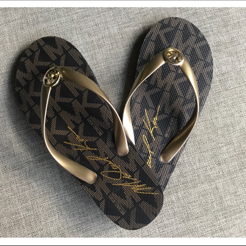 Michael Kors signature flip flops gold